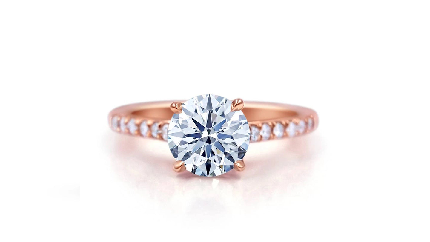 Round diamond engagement ring with rose gold pavé band